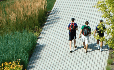 students walking on permeable pavement 